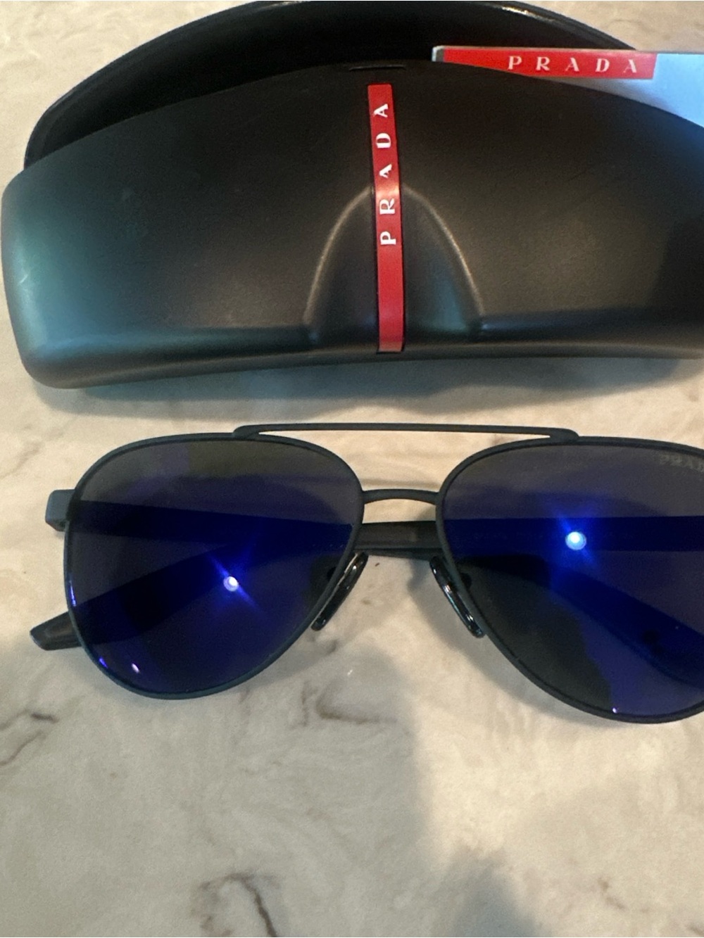 Prada Black Frame Sunglasses with Blue Lenses